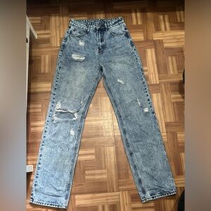 Distressed ripped acid washed jeans